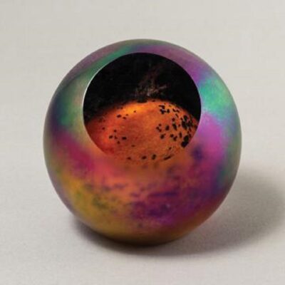 A colorful ball with a hole in it.