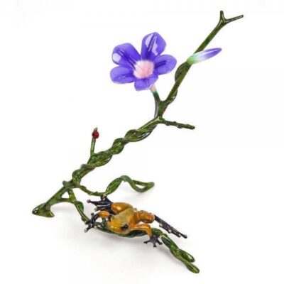 A purple flower and two yellow bugs on a branch.