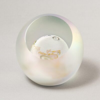 A white sphere with a light reflection on it.