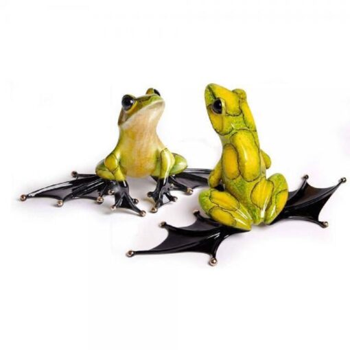 Two frogs sitting on top of a bat.