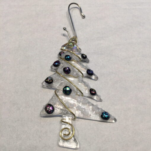 A metal christmas tree ornament with blue and black beads.