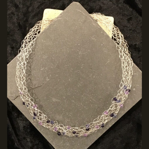 A necklace with purple beads on it