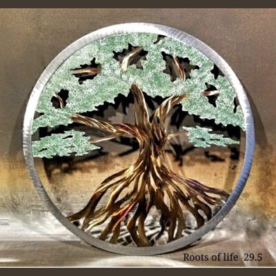 A picture of the tree of life on a metal disc.
