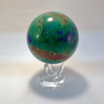 A green and blue marble on a stand.