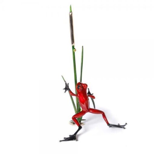 A red frog with long legs and a stick.