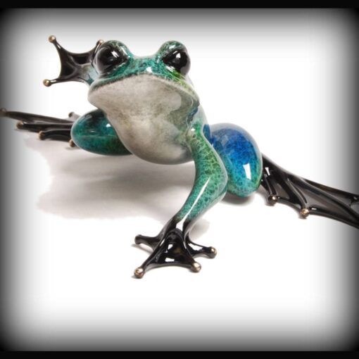 A frog with wings and a bat on its back.