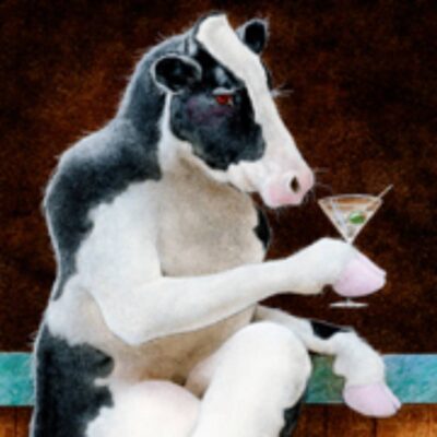 A cow sitting on the ground with a glass of wine.