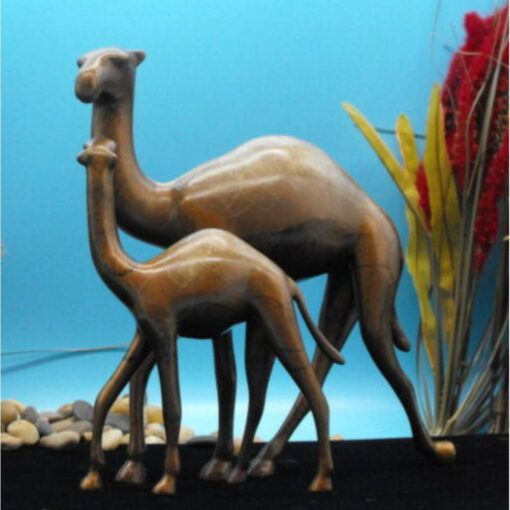 A couple of camel statues are standing next to each other