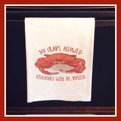 A towel with an image of a crab on it.