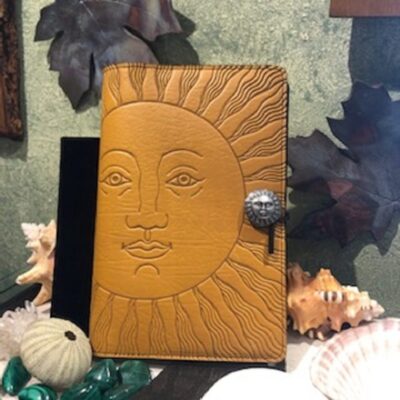 A sun face leather journal with key chain