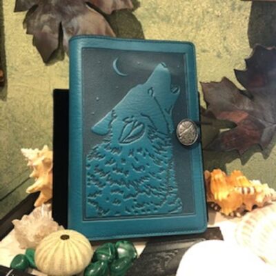 A blue book with a picture of a wolf on it.