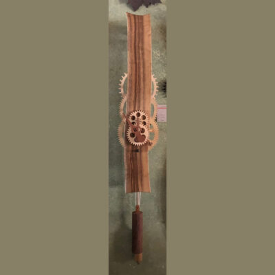 A wooden stick with a brown handle and a paw print on it.