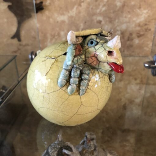 A yellow ball with a dragon on it