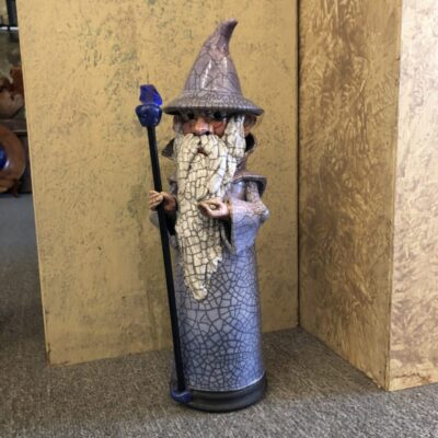 A statue of a wizard holding a staff.