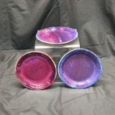 A set of three bowls sitting on top of each other.