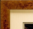 A picture frame with a brown wood grain finish.