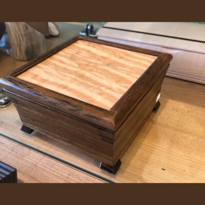 A wooden box sitting on top of the floor.