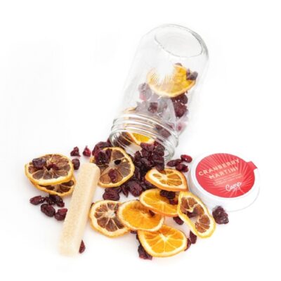A jar of dried fruit and a spoon